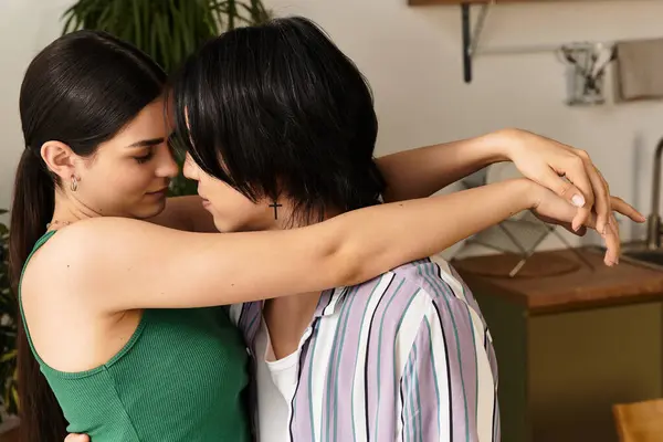 Loving couple embraces warmly at home, enjoying a peaceful moment together. — Stock Photo
