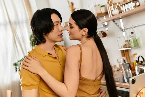 A couple finds joy in each others embrace, surrounded by intimate home comforts. — Stock Photo
