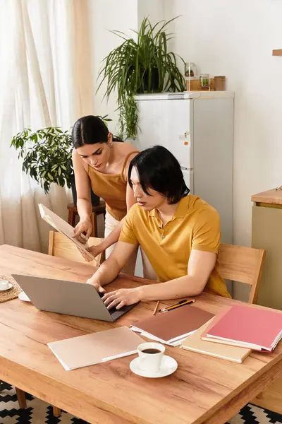 A man and woman collaborate on a project at their home, enjoying love and connection. — Stock Photo