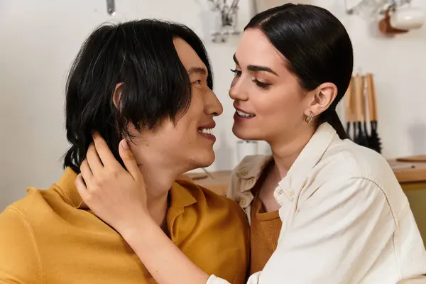 Loving couple enjoying an intimate moment at home as they connect and smile at each other. — Stock Photo