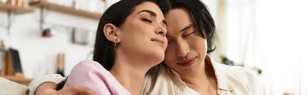 A couple embraces lovingly in a cozy, intimate space. — Stock Photo