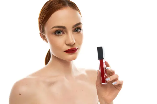 Beautiful woman with radiant skin and striking features demonstrates a bold red lip look with charm. — Stock Photo