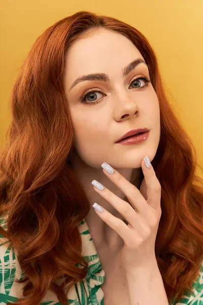 Young woman gracefully poses, highlighting her glossy nails and beautiful features. — Stock Photo
