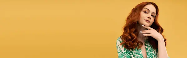 A beautiful young woman showcases her striking red hair and confident pose with elegance and charm. — Stock Photo