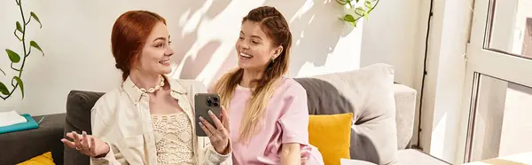 Two beautiful young women enjoy each others company while sitting comfortably in a stylish cafe, banner — Stock Photo