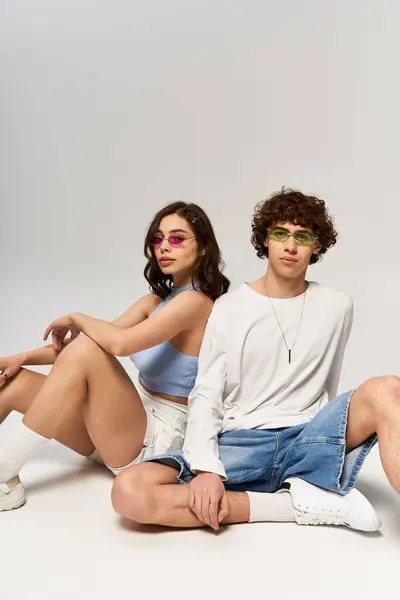 Stylish pair radiates love and confidence while posing in a chic studio environment. — Stock Photo