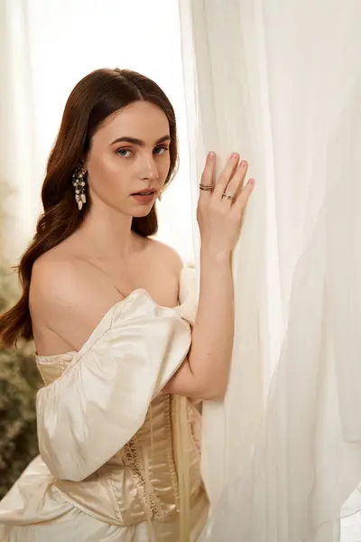 Graceful young woman in a vintage-inspired dress embraces the beauty of serene moments. — Stock Photo
