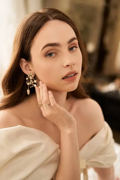 A beautiful young woman showcases her vintage style with a lovely dress and striking accessories. — Stock Photo