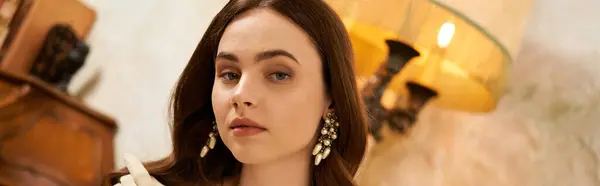 A graceful young woman in vintage attire sits, showcasing her elegance and beauty, banner — Stock Photo
