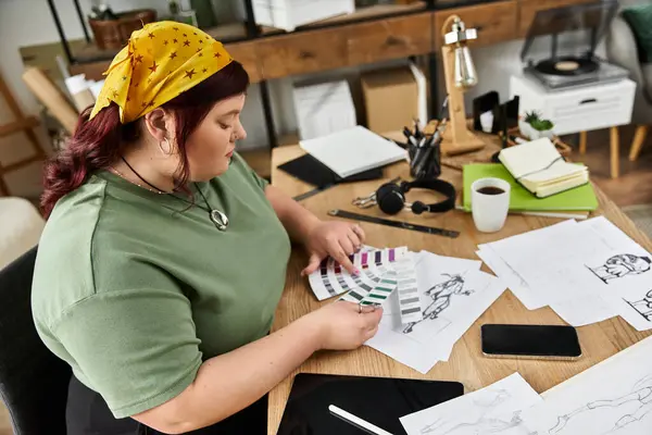 Creative woman engaged in artistic activities surrounded by sketches and color palettes — Stock Photo