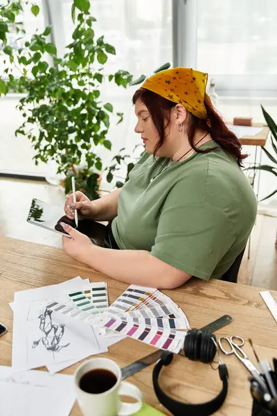 In a lively art studio, a woman embraces her creativity as she sketches and designs new ideas. — Stock Photo