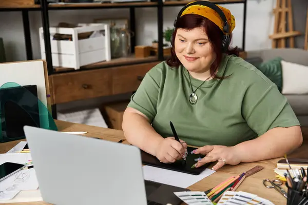 An elegant woman engages in artistic expression at a well designed studio full of materials. — Stock Photo