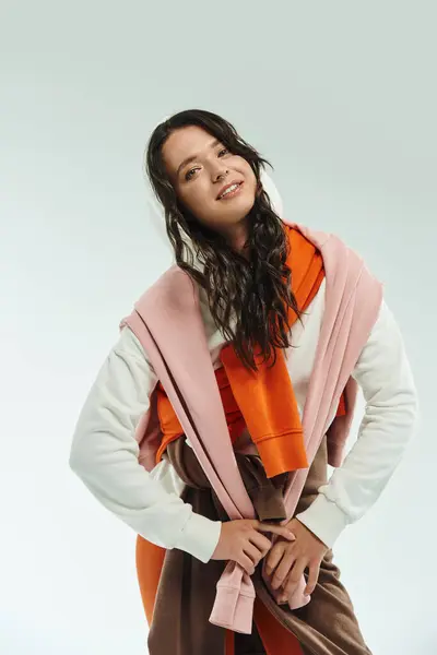 A stylish young woman poses confidently in eye catching layered outfits, showing her flair. — Stock Photo