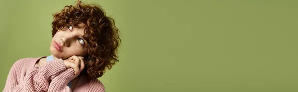 A young thoughtful woman with curly hair poses gracefully in a trendy outfit, banner — Stock Photo