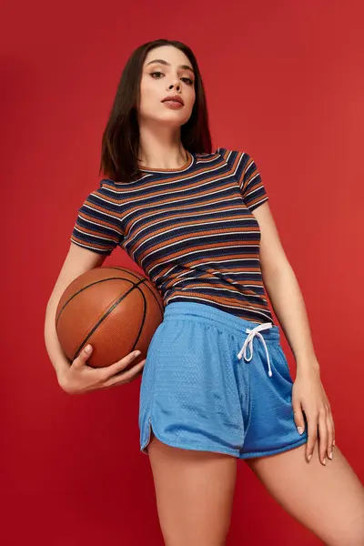 Young woman exudes confidence in trendy attire, balancing style and athletic spirit. — Stock Photo