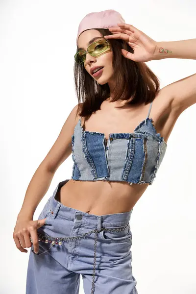 Stylish woman poses confidently in trendy denim top and colorful accessories with attitude. — Stock Photo