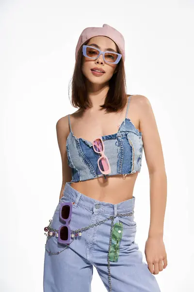 Young woman radiates confidence in a stylish outfit, blending denim with vibrant colors artfully. — Stock Photo
