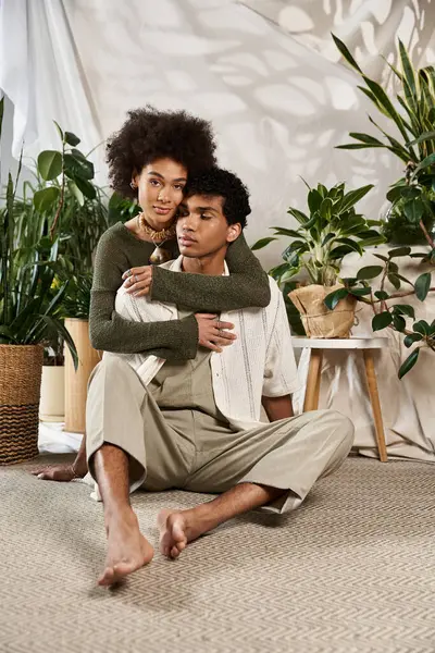 Una pareja amorosa disfruta de momentos íntimos, envueltos en calidez y estilo en un ambiente sereno. - foto de stock