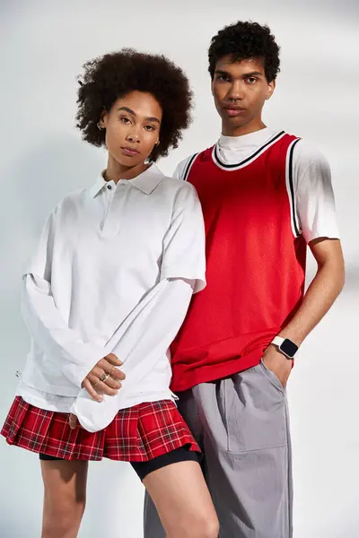 Young couple showcases their unique fashion sense with love and confidence in a chic setting. — Stock Photo