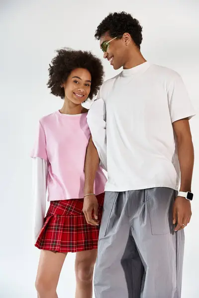 Trendy couple radiates joy and affection while enjoying each others stylish presence. — Stock Photo