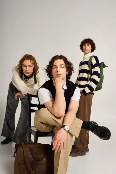 Young men with unique styles pose confidently together in a trendy studio environment — Stock Photo