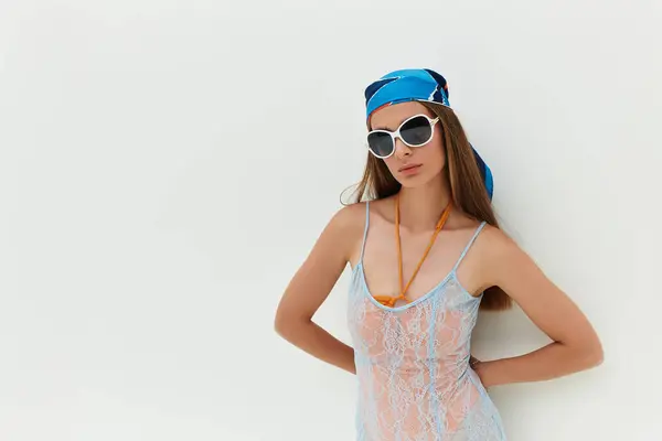 Beautiful young woman embodies summer joy in a fashionable outfit, exuding elegance outdoors. — стокове фото