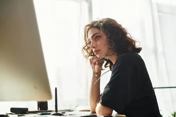 Young woman immersed in her work, showcasing focus and creativity in a home office. — Stock Photo