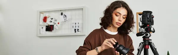 Curly-haired woman engages in photography while working comfortably from her home, banner — Stock Photo