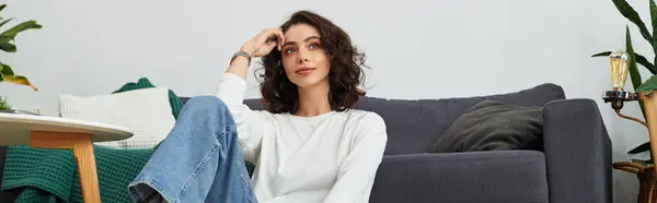 A beautiful woman relaxes in her modern apartment, reflecting on her day and embracing tranquility, banner — Stock Photo