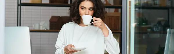 Freelancer relishes a moment of calm sipping coffee in her cozy home workspace, banner — Stock Photo
