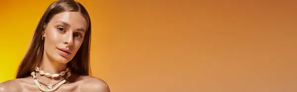 A young woman with tan skin and natural makeup radiates summer beauty in a vibrant setting, banner — Stock Photo