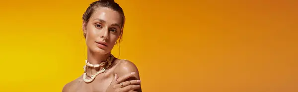 A young woman displays a summer outfit and seashell necklace, exuding natural beauty, banner — Stock Photo