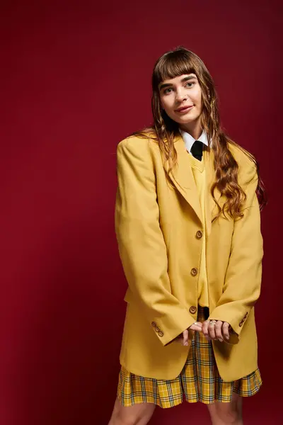 Brightly dressed woman stands proudly while showcasing her unique personal style with joy. — Stock Photo