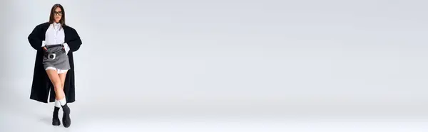 A young woman poses confidently in a trendy autumn outfit featuring a white shirt and skirt, banner — Stock Photo