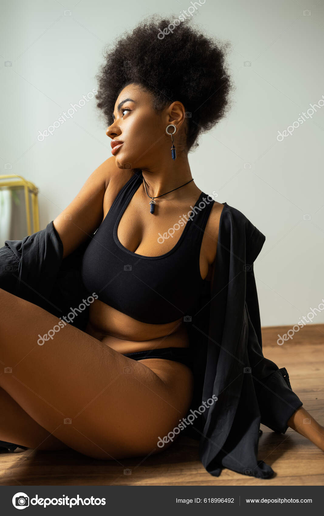 Side View African American Woman Black Shirt Underwear Sitting Floor Stock  Photo by ©AllaSerebrina 618996492