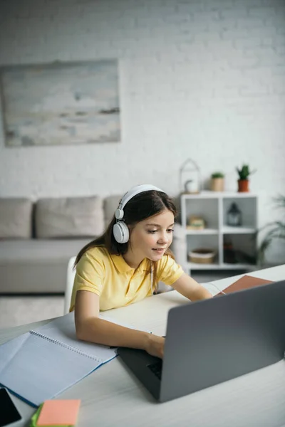 Positive Schoolgirl Headphones Using Laptop Living Room Home — Stock Photo, Image