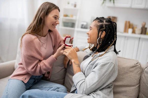 stock image lesbian woman making proposal to happy african american girlfriend on valentines day