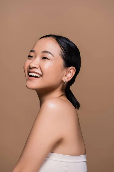 Pleased Asian Woman Top Looking Away Isolated Brown — Stock Photo, Image