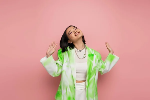 Joyful Asian Woman Green White Blazer Posing Closed Eyes Outstretched — Fotografia de Stock