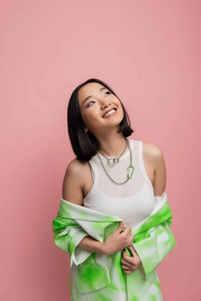 Happy Asian Woman White Tank Top Metal Necklaces Looking Away —  Fotos de Stock