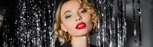 Blonde Young Woman Red Lips Looking Camera Shiny Tinsel Curtain — Foto de Stock