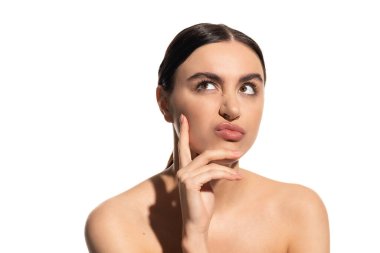 pensive woman with bare shoulders and flawless makeup pouting lips isolated on white 