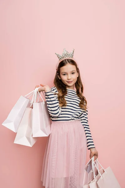 Carefree Preteen Kid Crown Headband Holding Shopping Bags Pink Background — Stock Photo, Image