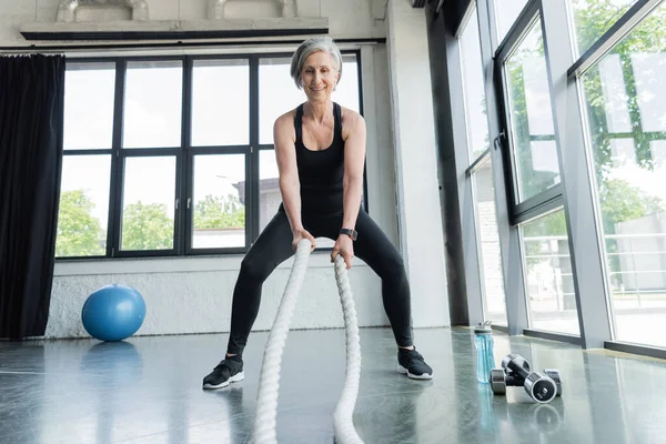 Full Length Fit Senior Woman Working Out Battle Ropes Dumbbells — Stock Photo, Image