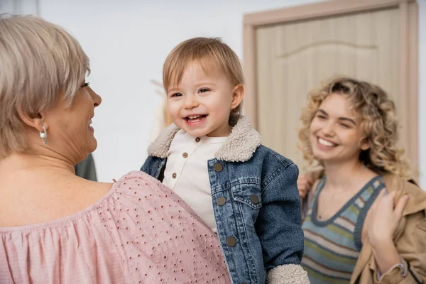 Middle Aged Woman Holding Happy Little Girl Denim Jacket Blurred — Stock Photo, Image