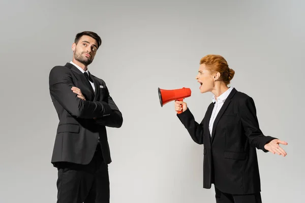 Irritated Businesswoman Shouting Calm Confident Manager Standing Folded Arms Isolated — Stock Photo, Image