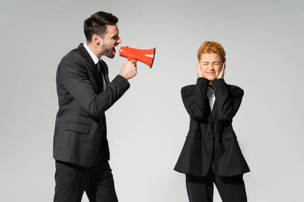 Redhead Manager Closed Eyes Covering Ears Hands Boss Screaming Megaphone — Stock Photo, Image