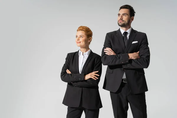 Happy Redhead Businesswoman Confident Businessman Crossed Arms Looking Away Isolated — Stock Photo, Image