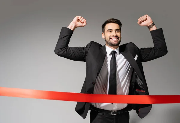 Joyful Businessman Black Stylish Suit Showing Win Gesture While Crossing — Stock Photo, Image