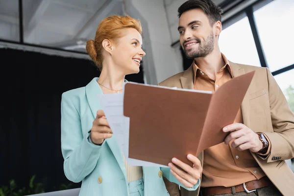 Joyful Business Partners Looking Each While Talking Folder Papers Office — Stock Photo, Image